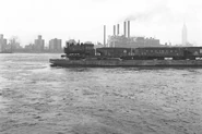 No. 15 pulling a small freight by the dockside.