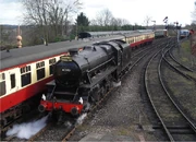  No.45110 with at  on the re-opening date of 21 March 2008. The locomotive carries a headboard commemorating the re-opening.