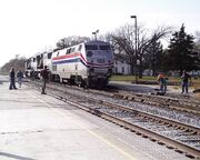 Amtrak #49 with damage and rail crews providing assistance