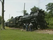 No. 587 is getting ready to pull a passenger train.