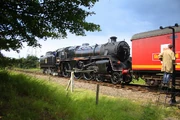 The flagship locomotive British Railways Class Standard Five  takes on water at Peterborough Nene Valley