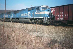 A Conrail SD70MAC (with another unit coupled leading a coal drag to the one shown