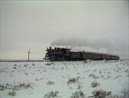 No. 18 travels through a long track in the snow.