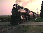 No. 7002 and 1223 passing the Red Caboose motel.