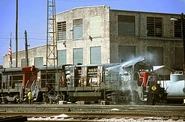 A rarity during the "dirty era" of the SP in the 1970's: two GE Dash 7 units are washed by an inspection crew in Houston, TX sometime during the 70's.