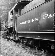 A boy in the locomotive's cab.