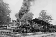 Morehead & North Fork #12 (ex-Southern #1643) collecting coal from the coal tipple at Clearfield, Kentucky in 1960.