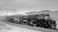 Union Pacific No. 4004 and 4013 team up to doublehead a train over Sherman Hill on the way from Laramie to Cheyenne in August 1958.