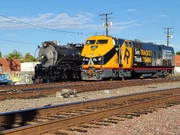 Amtrak 203 in its Operation Lifesaver paint scheme next to Santa Fe No. 3751