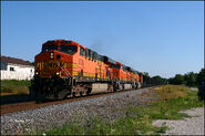 BNSF ES44AC #5726 leads a Green Bay bound coal train on the CN in Waukesha, WI, Jul 2010. This unit is one of the pre-production units. Note the AC4400CW class on the frame.