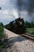Nickel Plate Road 587 pulls out of Bulls Gap,Tn on the "BL line" in Aug 1989.