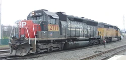A patched (locomotive with patchwork) Union Pacific diesel locomotive, which is a former Southern Pacific EMD SD45, UP #2777.