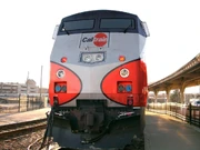 A P32AC-DM being painted in the fictional "Caltrain" paint scheme.