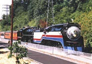 In 2003 No. 700 is doubleheading with SP No. 4449 while wearing the American Freedom Train paint scheme.