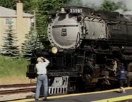 3985 being photographed by a railfan