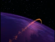 The background of the first part of the logo where the comets circle around the globe.
