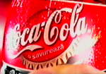 Romanian logo with slogan "Savurează Coca-Cola"