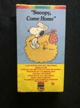 An example of the CBS/Fox Children’s Video logo on a VHS box: Snoopy, Come Home (Owned by WildBrain)