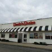 A building with the orangy-red wordmark. Most locations still use this logo.