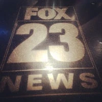 Logo seen from a spotlight on the floor of the studio