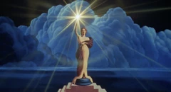 The torch lady at the beginning of the logo.