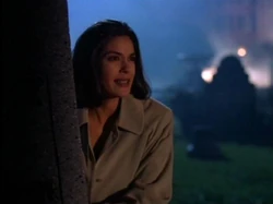 Lois investigating a cemetery after a tip off from Mrs