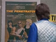 Tempus looking at a poster of the Penetrator film