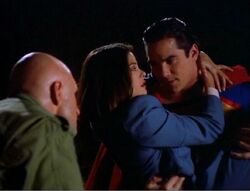 Lois being saved by Superman from a now revived Lex Luthor