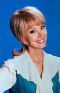 Shelley as Carol Brady in The Brady Bunch film series