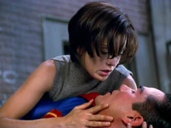 Lois trying to revive an unconscious Superman