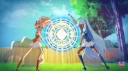 Talia and Auriana casts Crystal Retrocium in front of the twins