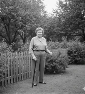 Gromdy at the age of 79 in April 1982, standing in her backyard.