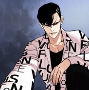 Gun holding Eli by his chin