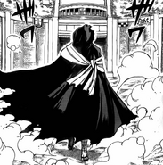 Domon covered by his cloak.