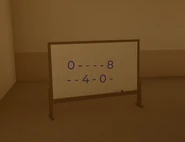 Clue on a whiteboard behind the tinted glass in room overlooking reception.