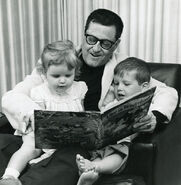 Bob reading Disney’s Alice in Wonderland to Ruth and Bob, Jr