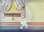 The Bugs Bunny prototype, as dusts his hands off after he finishes using his magic on the boxer.