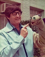 Bob with a puppet of Cecil the Seasick Sea Serpent