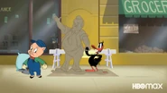 Daffy with his creator Tex Avery in the style of the Disney statue "Partners"