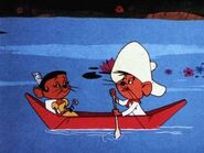 Speedy and his girlfriend in a boat