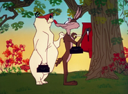 Ralph Wolf and Sam Sheepdog punching the time clock