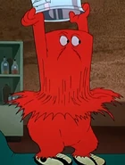 Gossamer shaped as a trash can after being thrown out by Bugs.