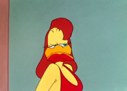 Shapely Lady Duck growls after kissing Daffy two more times.