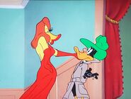 Caresses Daffy's beak