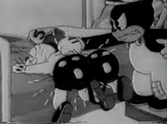 FA12.jpg (15 KB) Beans giving Ham/Ex a spanking