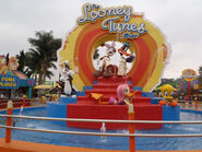 At a Six Flags park to promote The Looney Tunes Show