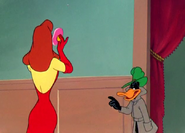 Daffy continues accusing Shapely Lady Duck of murder.
