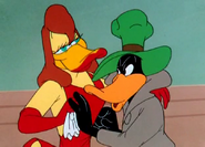 Wipes lipstick marks off Daffy's face