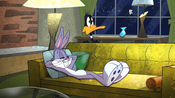 Daffy walks in and starts to watch too.