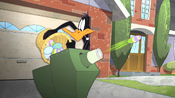 Daffy throws eggs in a machine on Easter.